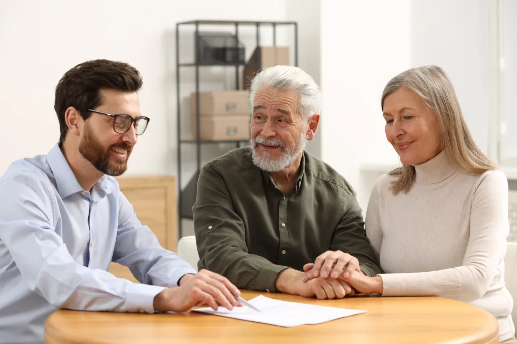 Notary consulting senior couple about Last Will and Testament in office